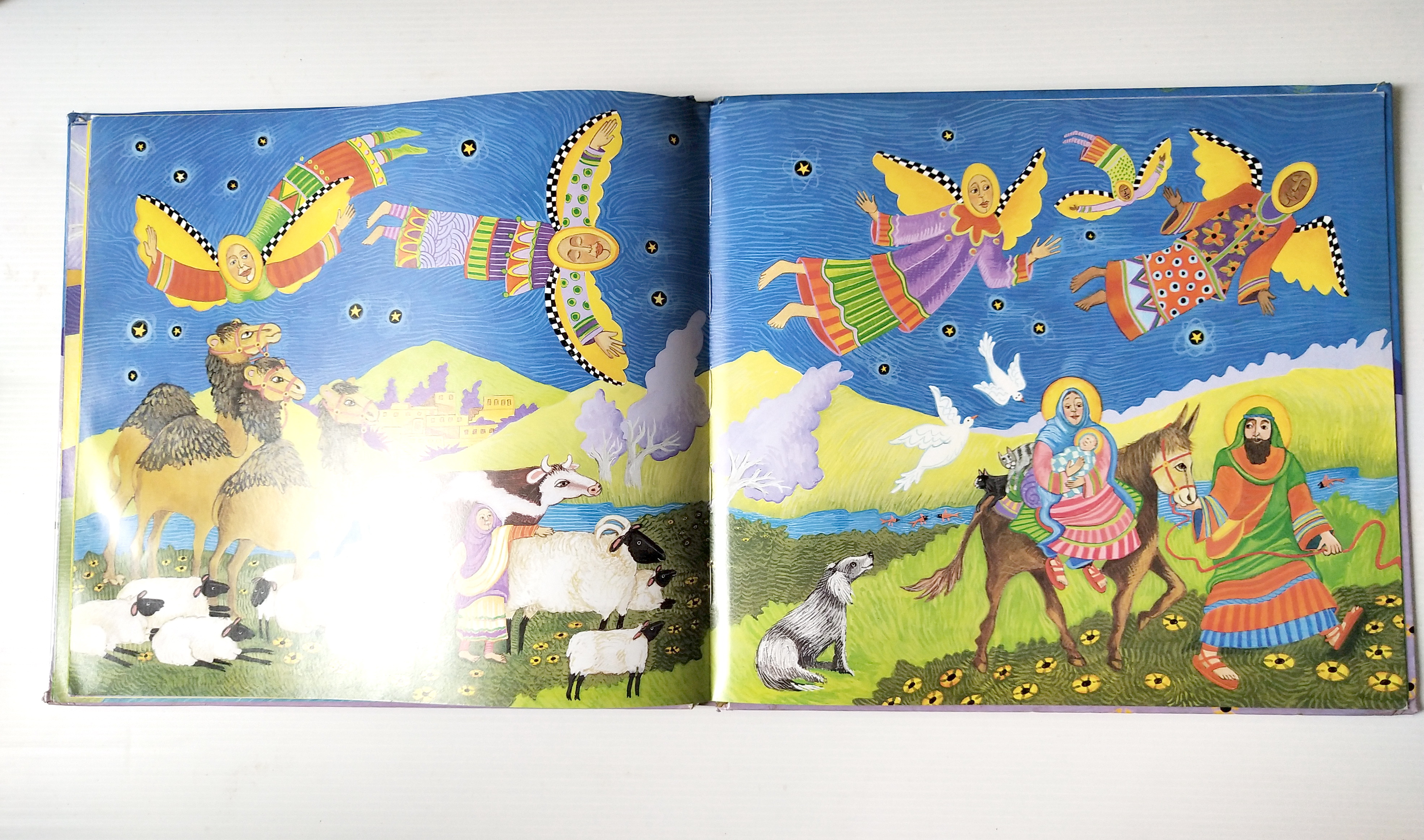 หนังสือนิทาน**มีตำหนิ โปรดดูทุกภาพ ฉบับภาษาอังกฤษ The Friendly Beasts ,a Christmas Carol. ภาพโดย Sharon MacGinley