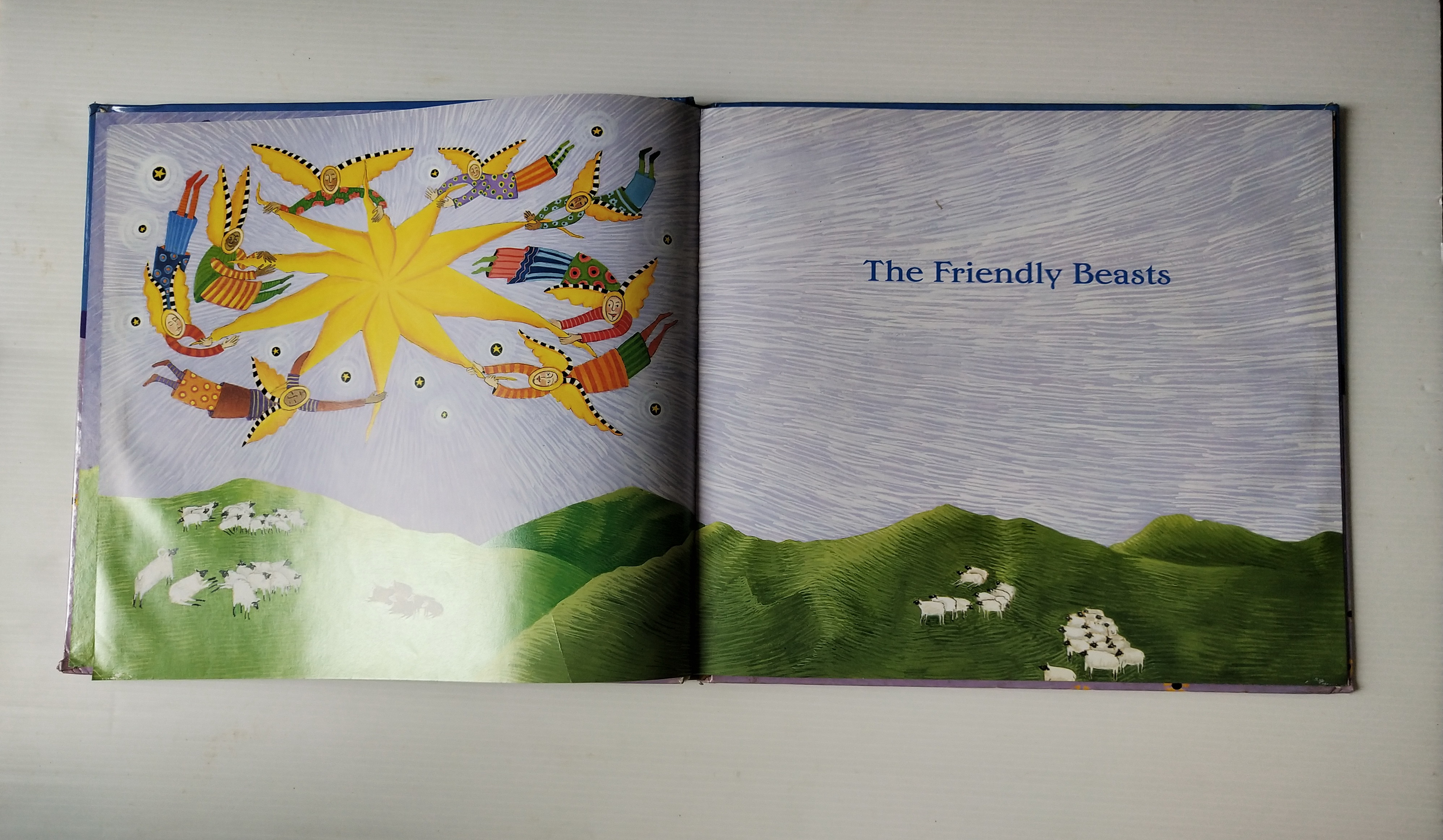 หนังสือนิทาน**มีตำหนิ โปรดดูทุกภาพ ฉบับภาษาอังกฤษ The Friendly Beasts ,a Christmas Carol. ภาพโดย Sharon MacGinley