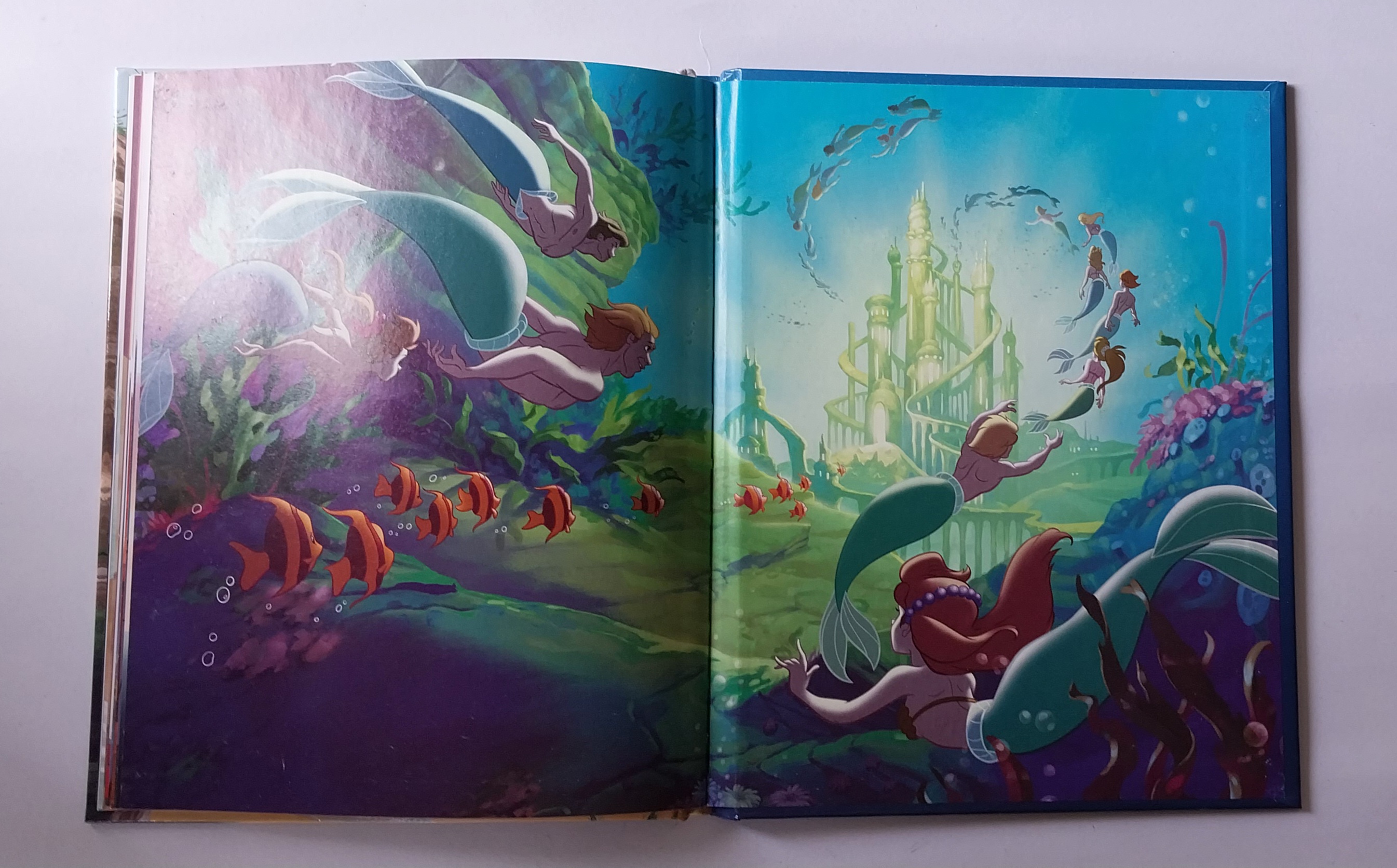 มีหลายภาพ,เจ้าหญิงเงือกน้อยแอเรี่ยล,หนังสือนิทานปกแข็งภาษาอังกฤษ ขนาด 22 ใหม่-มีเพชรติดที่เสื้อเจ้าชายอีริกที่หน้า22 ซม. Disney, the Little Mernaid,Magical story.ปกเป็นภาพ3มิติ ปีที่พิมพ์ 1012