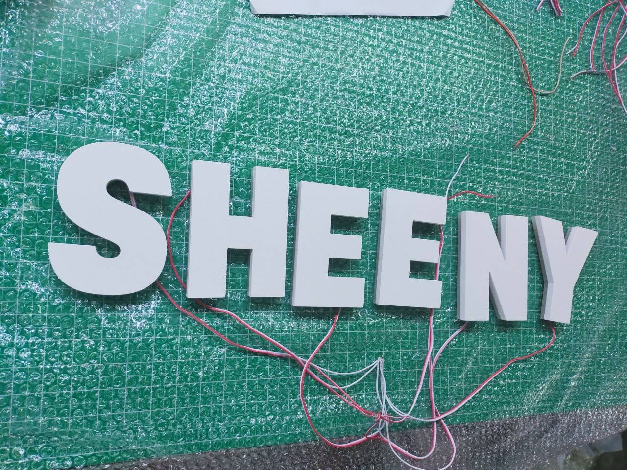 งานป้ายไฟออกหลัง - SHEENY