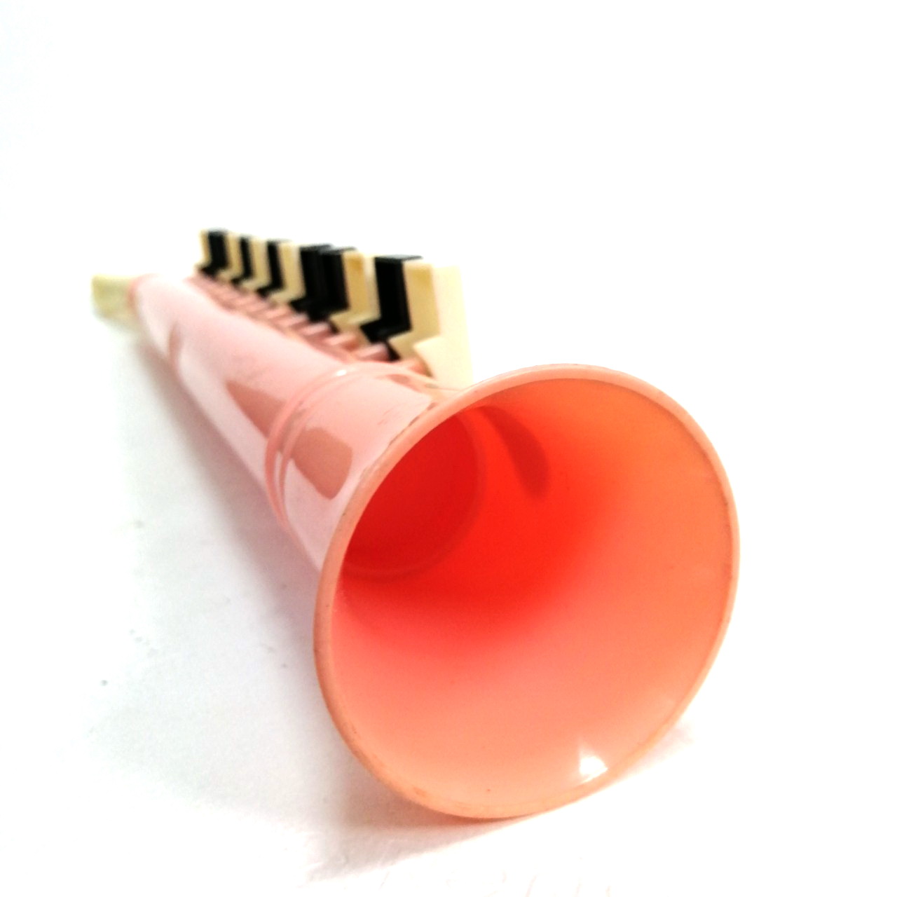 ทรัมเป็ต พลาสติก(ตัวใหญ่ รุ่น17นิ้ว)สีชมพู เป่าไล่ตัวโน๊ตได้/เป่าเป็นเพลงได้ การเล่นเหมือนเมโลเดี้ยน เก่าเก็บ สภาพดี มีรอยบ้าง