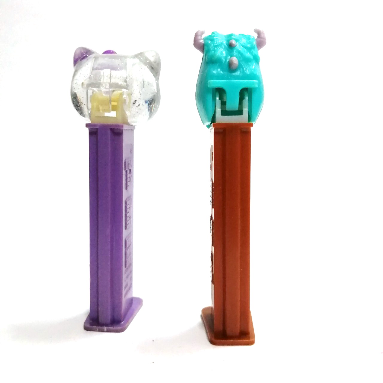 ที่ใส่ขนม PEZ รูป คิตตี้(ใส)และ มอนสเตอร์อินค์ งานเก่าเก็บ ขายตามสภาพ ขายคู่