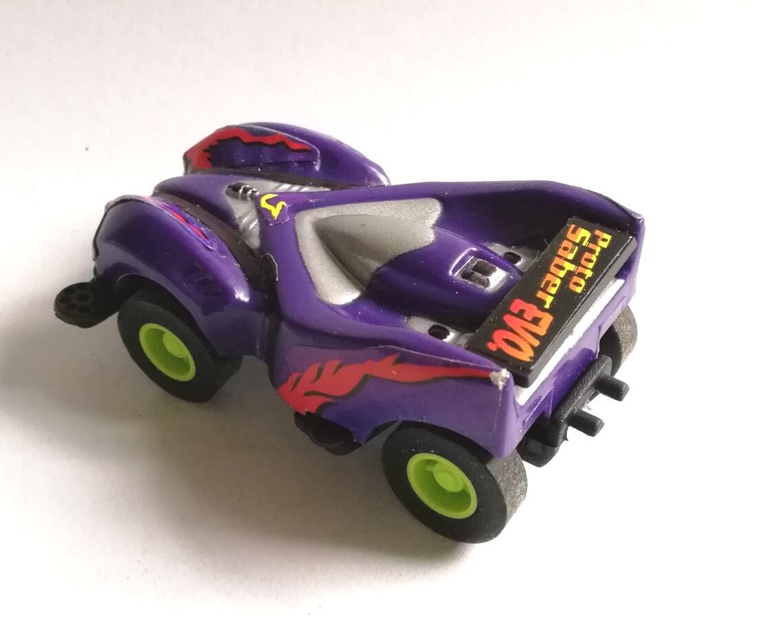 โมเดลรถแข่งในแคปซูล สีม่วง ขนาดประมาณ 5.5 cm. pull back ของสะสมเก่า จาก 7-11