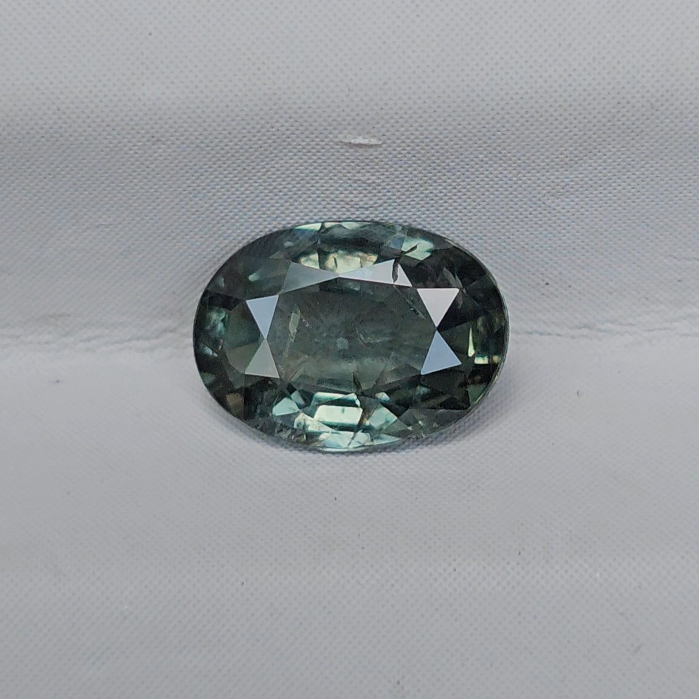 พลอย เขียวส่อง Blue-Green Sapphire 0.77 กะรัต (Cts.) ดิบ (Unheated) พลอยแท้ อัญมณีมงคลประจําวันเกิด เครื่องประดับพลอย