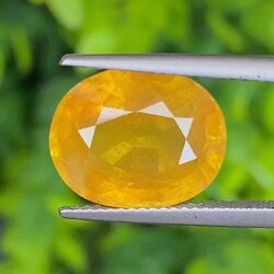พลอย บุษราคัม เผาใหม่ yellow sapphire 11.82 กะรัต (Cts.) พลอยแท้ อัญมณีมงคลประจําวันเกิด เครื่องประดับพลอย