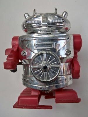 ตุ๊กตาหุ่นยนต์ไขลาน หน้าอกมีใบพัดสีแดง-เงิน งานเก่า สำหรับตั้งโชว์**ลานเสีย