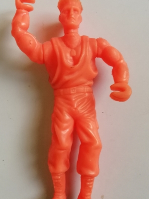 ของเล่น ของสะสม ตุ๊กตาพลาสติก 4 นิ้ว แถมขนมขบเคี้ยว ตัว กิล gill จาก สตรีท ไฟเตอร์ Street Fighter พลาสติกสีส้ม โพสท่าตายขยับไม่ได้ เก่าเก็บตามสภาพ