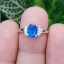 แหวนโทพาส สีน้ำเงิน ( Blue Topaz Ring) (Size) 52 ตัวเรือนเงิน ชุบทองคำขาว/โรเดียม ประดับด้วยเพทาย เพชร CZ คัดคุณภาพ